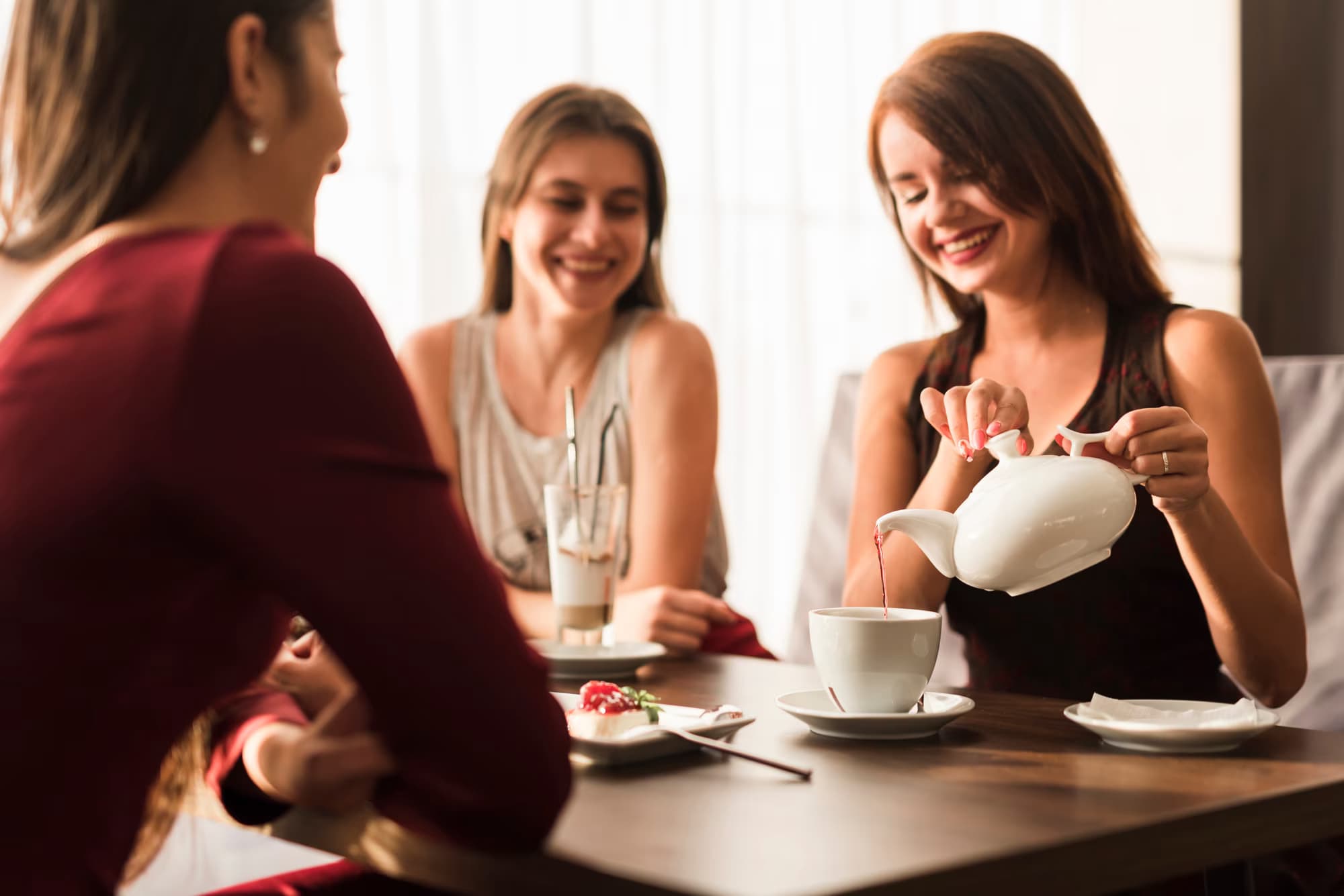 Friends sharing tea and laughter